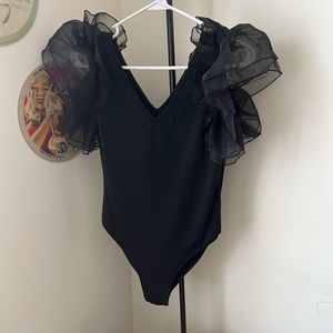 Fun, flirty body suit. Mesh/puffy sleeves. Size L.